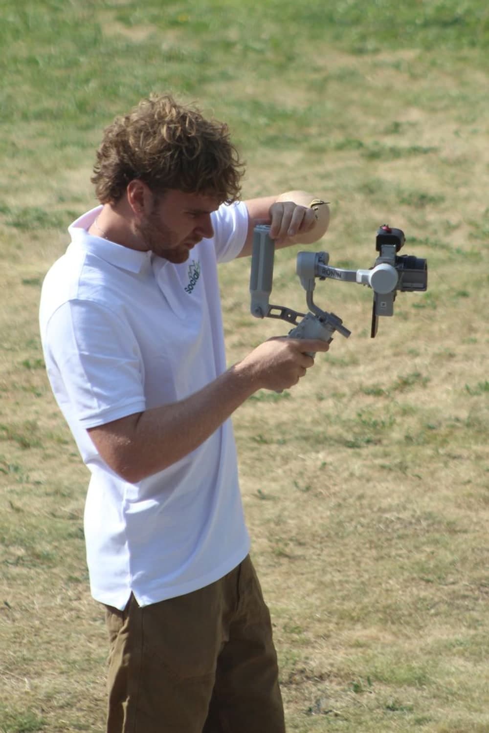 Social Climb videographer operating a DJI Ronin gimbal rig on location