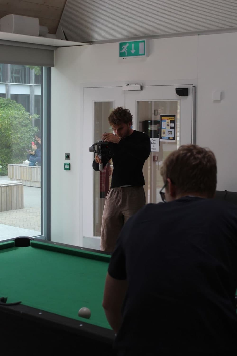 Shooting handheld camera coverage indoors during a content day